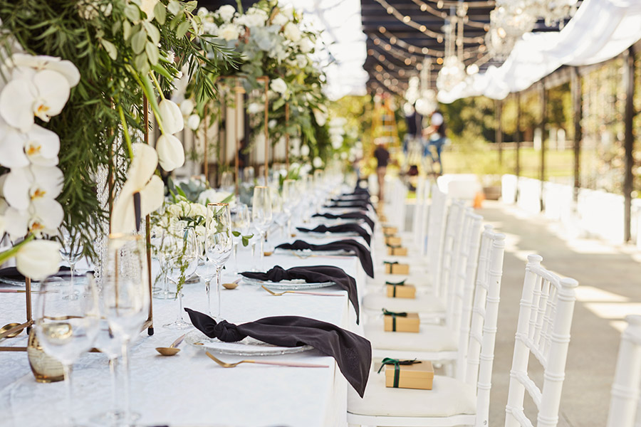 Floral centerpieces with white chairs